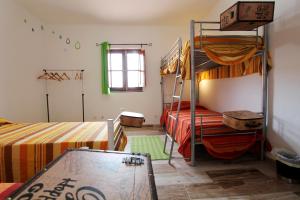 a room with two bunk beds and a table at Horta Grande in Silves +60 photos
