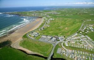 an aerial view of a beach and the ocean at Bellbridge Cottage in Milltown Malbay