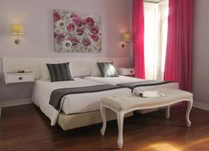 Ένα ή περισσότερα κρεβάτια σε δωμάτιο στο Hotel Jardim Viana do Castelo