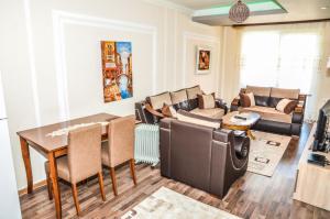 a living room with a table and a couch at Apartments Monte in Ulcinj