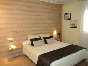 Postel nebo postele na pokoji v ubytování Hotel Helmántico