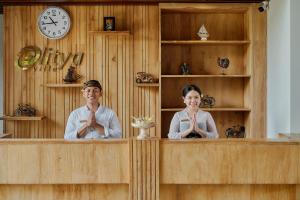 a man and a woman sitting in front of a mirror at Elitya Ubud Villa in Ubud +195 photos