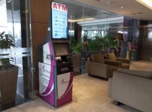 an atm machine in the lobby of a building at Orchardz Hotel Bandara in Tangerang
