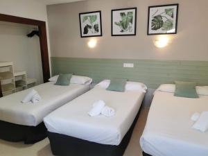 Postel nebo postele na pokoji v ubytování Hotel Costa Andaluza