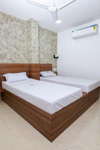 Postel nebo postele na pokoji v ubytování Balu Residency - A Business Class Hotel + 13 fotografií