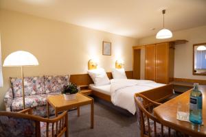 Postel nebo postele na pokoji v ubytování Hotel Liederbacher Hof