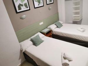 Postel nebo postele na pokoji v ubytování Hotel Costa Andaluza