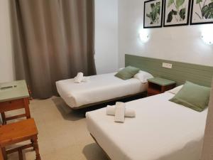 Postel nebo postele na pokoji v ubytování Hotel Costa Andaluza