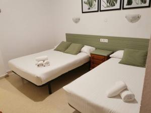 Postel nebo postele na pokoji v ubytování Hotel Costa Andaluza