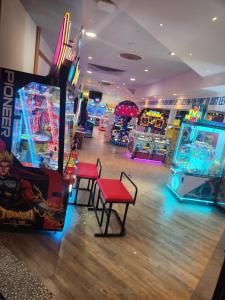 a room with arcade games and a video game at Seaton Sands 71 Aberlady in Port Seton