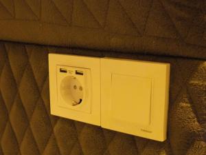 a white appliance on a wall in a room at ÇANKAYA BOUTiQUE HOTEL in Bahçelievler +7 photos