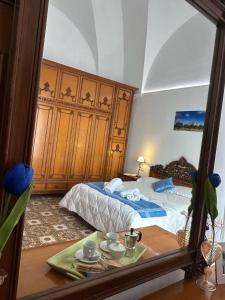 Postel nebo postele na pokoji v ubytování stanza zaffiro azzurro