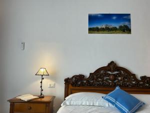 Postel nebo postele na pokoji v ubytování stanza zaffiro azzurro