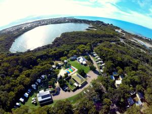 an aerial view of a house on a island next to the water at Robe Holiday Park in Robe