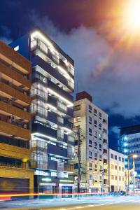 a tall building with a street in front of it at Montana Wing Yebisu in Osaka