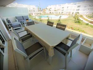 a table and chairs in a room with a view at Ocean Home - Costa Ballena in Costa Ballena