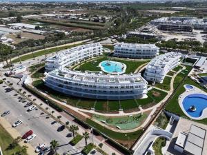 an aerial view of a large building with two pools at Ocean Home - Costa Ballena in Costa Ballena