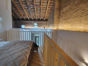 a bedroom with a large bed and a wooden ceiling at Mandarina Suites - Unique apartments in Valencia in Valencia