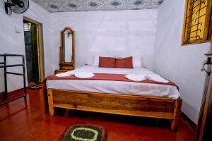 Postel nebo postele na pokoji v ubytování Little Cabanas Udawalawe