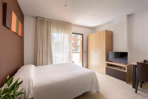 Postel nebo postele na pokoji v ubytování SG Costa BCN Apartments