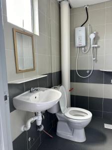 a bathroom with a toilet and a sink at Forever Green cameron in Brinchang +19 photos