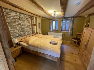 Postel nebo postele na pokoji v ubytování Haus An der Rur - 5 Apartments mitten in Monschau