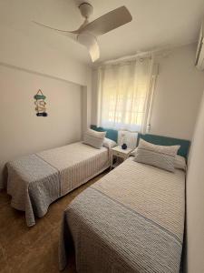Postel nebo postele na pokoji v ubytování Casa Playa del Corral