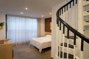 Postel nebo postele na pokoji v ubytování SG Costa BCN Apartments