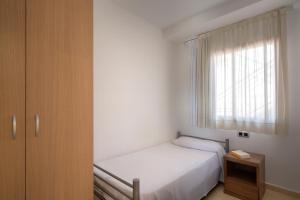 Postel nebo postele na pokoji v ubytování SG Costa BCN Apartments