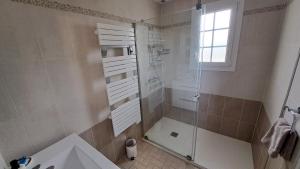a bathroom with a shower and a toilet and a sink at Maison en bord de Rance in Taden +11 photos