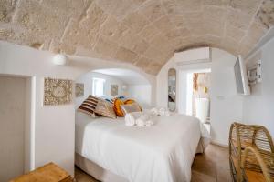 Postel nebo postele na pokoji v ubytování Apulia Charming Suites - Casa Lonfo Suite Sole