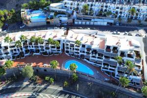 an aerial view of a building with a pool at Playa del Cura - Mar Paraiso in Playa del Cura