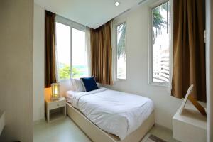 Ένα ή περισσότερα κρεβάτια σε δωμάτιο στο Homely 2 BRs Apartment Nimman +36 φωτογραφίες