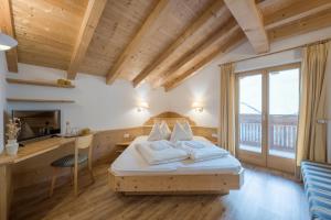 Postel nebo postele na pokoji v ubytování Pension-Appartement Mitterhofer + 37 fotografií