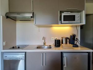 Dapur atau dapur kecil di Birdie - face au golf, proche plage et activités
