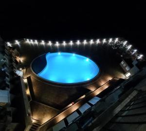 an overhead view of a swimming pool at night at L'incanto Blu in Teulada