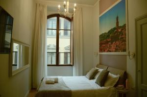 Posteľ alebo postele v izbe v ubytovaní B&B Dimora Sassetti 6
