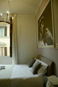 Posteľ alebo postele v izbe v ubytovaní B&B Dimora Sassetti 6