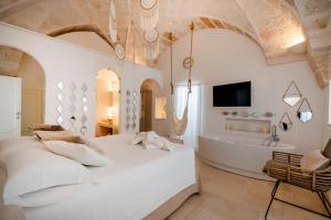 Postel nebo postele na pokoji v ubytování Apulia Charming Suites - Casa Rossa Suite Perla e Suite Corallo