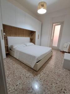 Postel nebo postele na pokoji v ubytování Camera Alghero Centro
