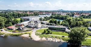 an aerial view of a city with a river at Hotel Active Stadium in Lovosice