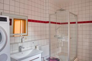 a bathroom with a shower and a sink at Ferienwohnung Silvia in Villingen-Schwenningen +30 photos