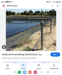 a fence with a sign that reads industrial pond nesting l bird b gone inc at AgriSolutions BnB in Malonje