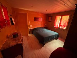 Postel nebo postele na pokoji v ubytování chalet vosgien