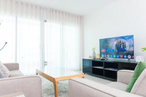 Televisyen dan/atau pusat hiburan di Darwin Harbour Suite