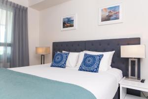 Katil atau katil-katil dalam bilik di Darwin Harbour Suite
