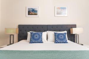 Katil atau katil-katil dalam bilik di Darwin Harbour Suite