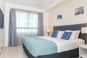 Katil atau katil-katil dalam bilik di Darwin Harbour Suite