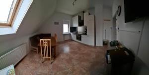 TV a/nebo společenská místnost v ubytování Gästezimmer / Weingut Peter