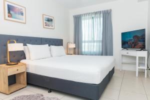 Katil atau katil-katil dalam bilik di Darwin Harbour Suite